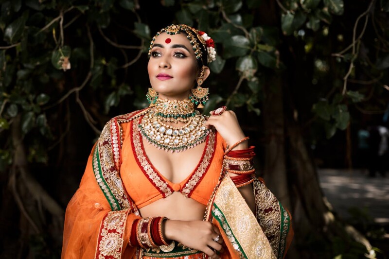 free-photo-of-ethenic-fashion-photoshoot-of-a-young-girl-in-orange-creative-light
